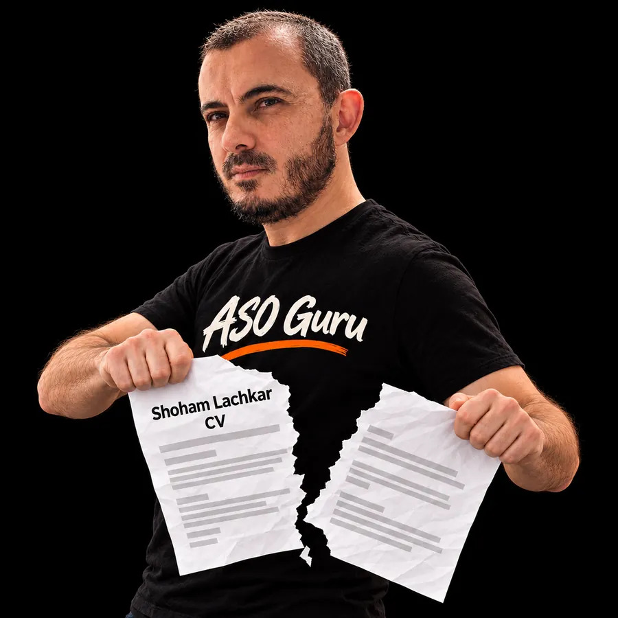 Gabriel Machuret in an ASO Guru T-shirt tearing a mock CV labelled Shoham Lachkar